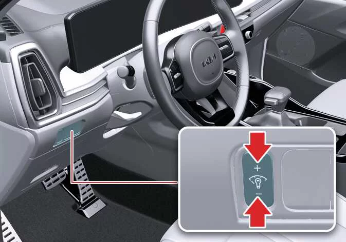 Dashboard illumination brightness control buttons located near the steering column in a Kia Sorento