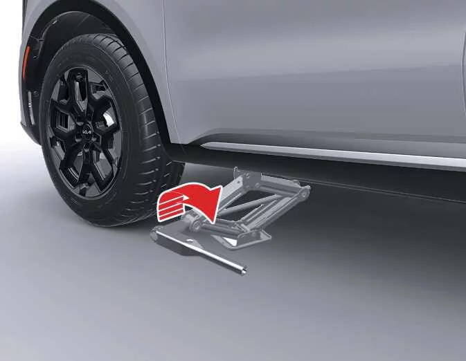 Elevating the Kia Sorento using the emergency mechanical jack handle