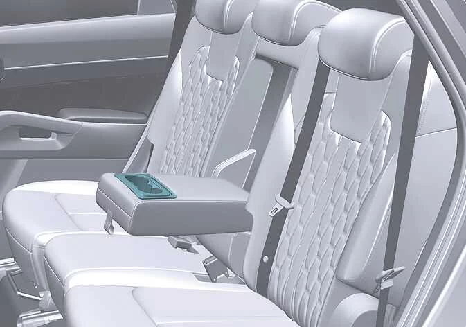 Rear passenger armrest cup holder compartment in the Kia Sorento