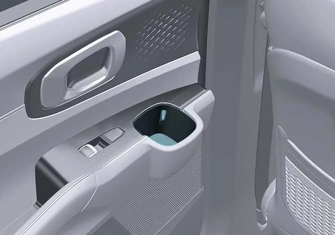Retractable cup holder mechanisms integrated into the Kia Sorento interior trim