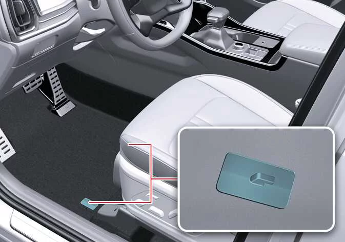 Driver side floor mat securing anchor hooks on the carpet of the Kia Sorento