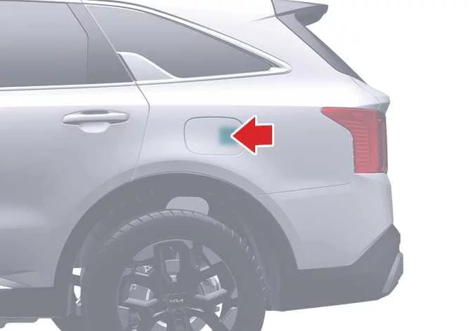 Location and technique for pressing the outer rear edge of the fuel filler door on the Kia Sorento