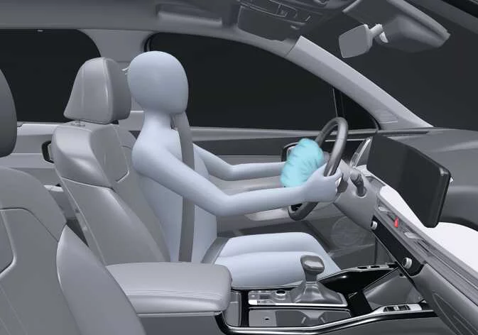 Location of the driver front airbag module inside the Kia Sorento steering wheel hub