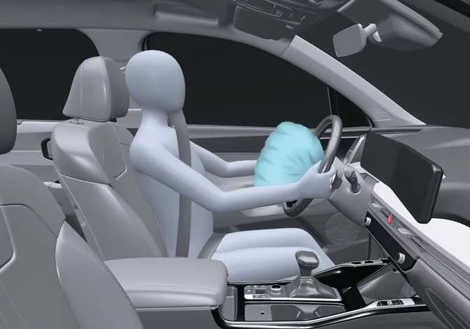 Tear seam cover breaking open as the driver front airbag deploys in a Kia Sorento