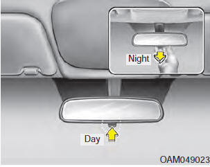 before you start driving and while the day/night lever is in the day position.